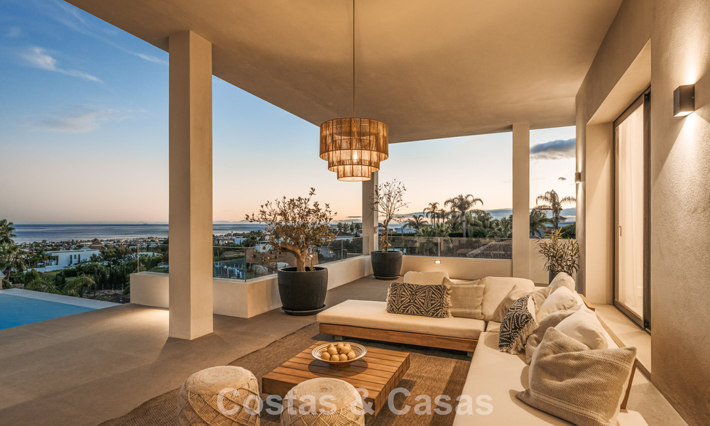 Exclusieve designvilla met panoramisch zeezicht te koop in het een vijfsterren golfresort in Marbella - Benahavis 74806